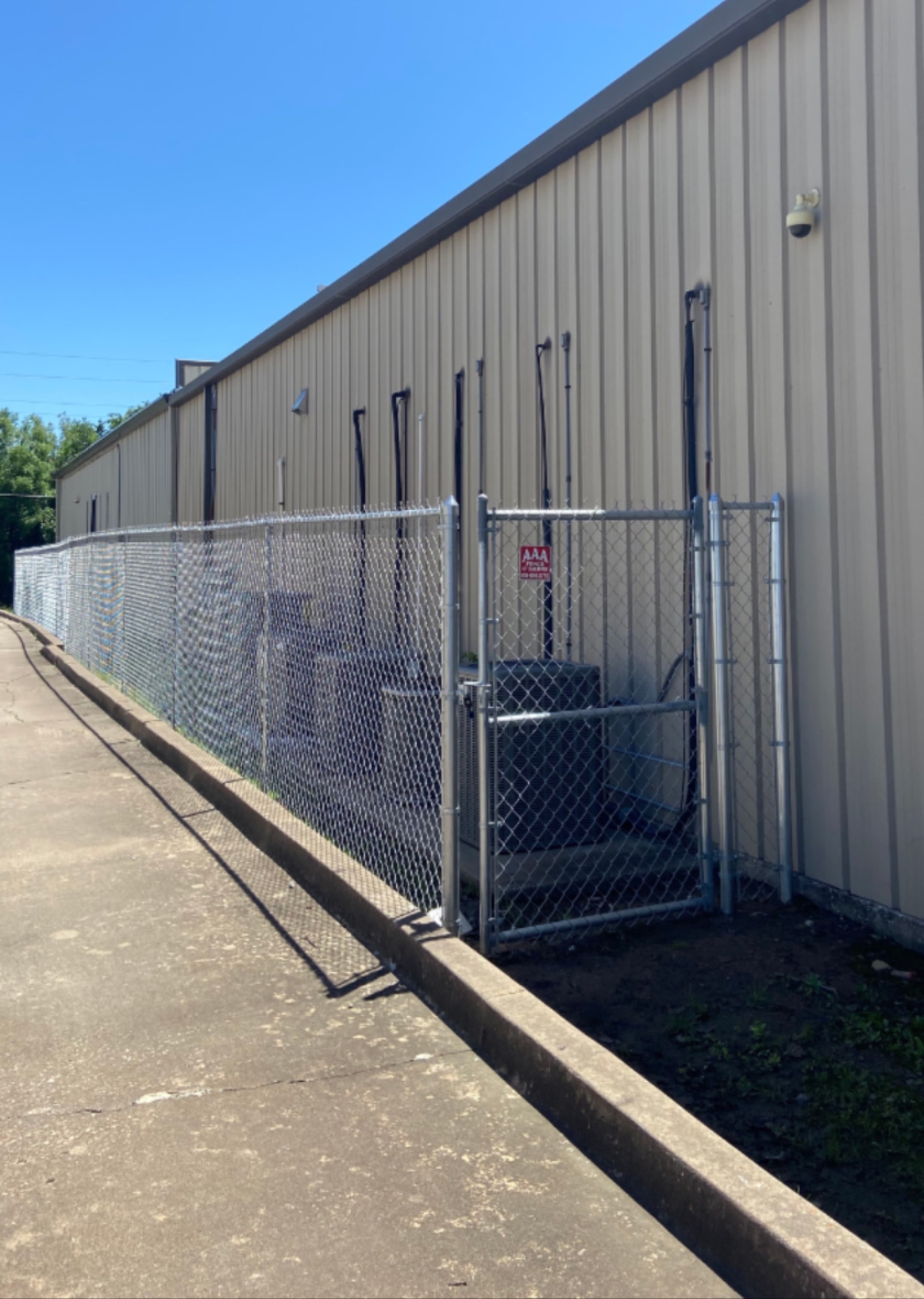 Chain link fence installation by AAA Fence & Barns